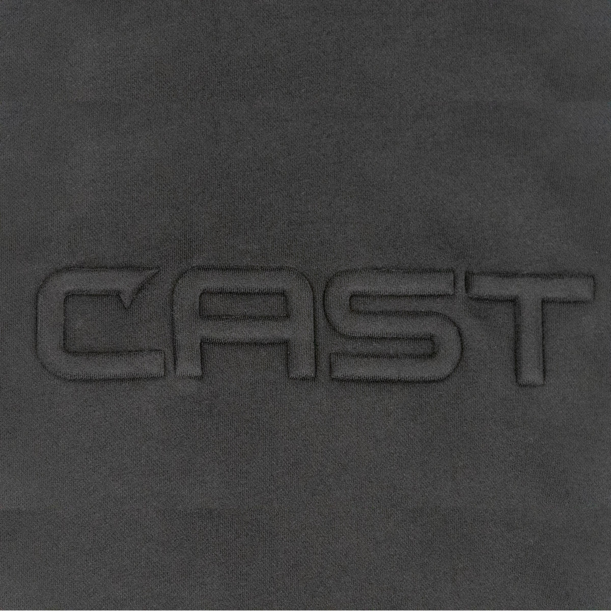 Tone-on-tone puffed CAST emboss on the Black Reel Heavy hoodie