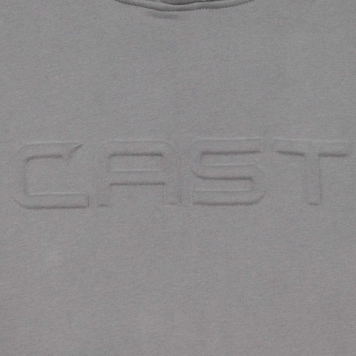 Tone-on-tone puffed CAST emboss on the Cement Reel Heavy hoodie