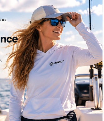 Woman wearing white CAST BreezeTec hooded performance shirt on the water